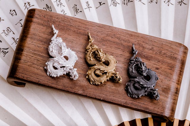 Front view of granite stone dragon sculpture with fierce expression and detailed carved eyes