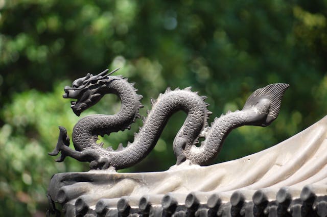 Large emperor dragon sculpture as garden centerpiece, bringing bold mystical energy to outdoor spaces